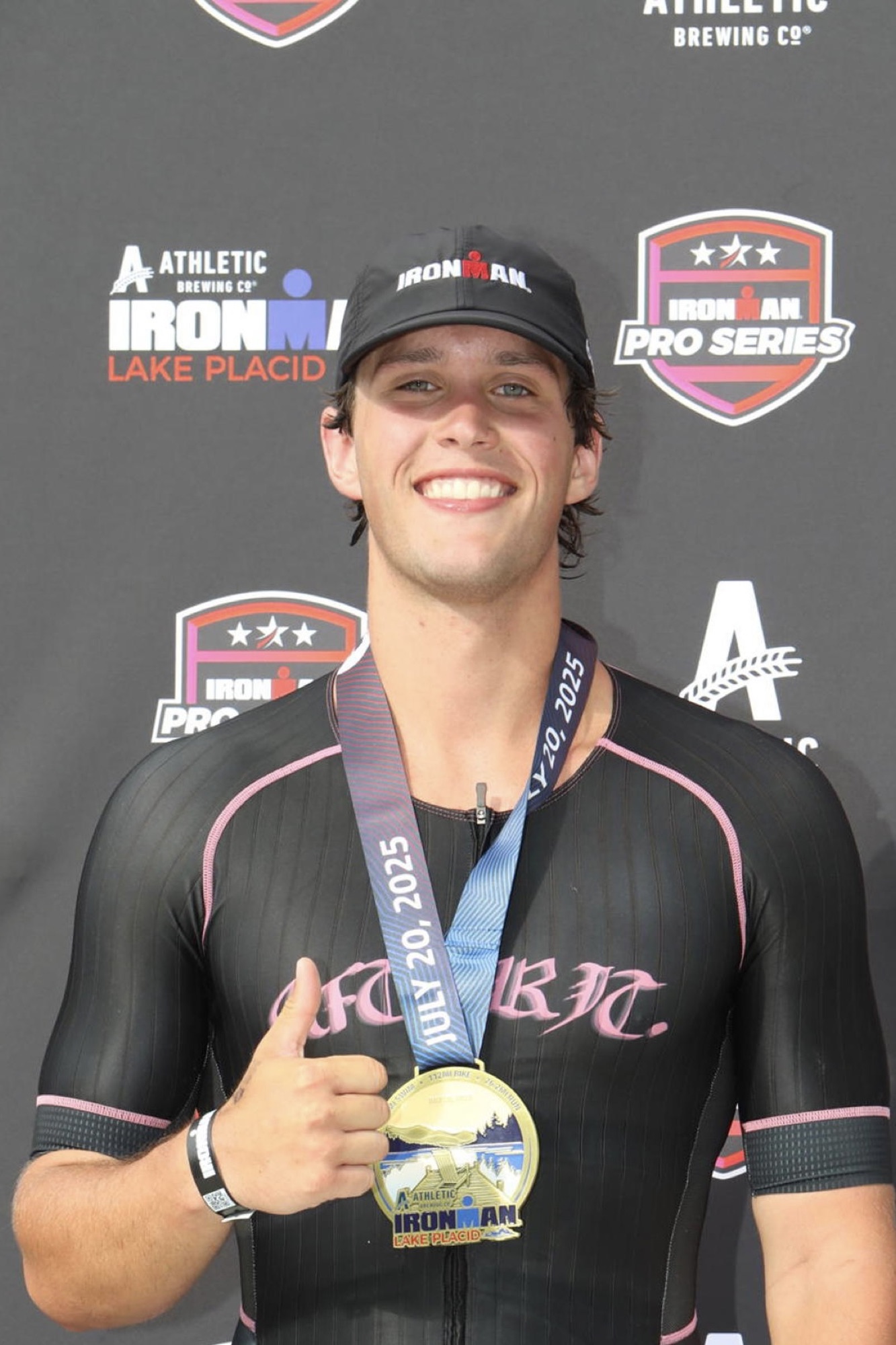 Pat with his IRONMAN Lake Placid 2025 finisher medal