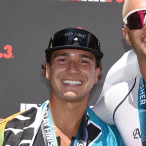 Anthony, smiling with his 70.3 finisher medal